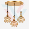 Suspension triple dorée avec trois boules décoratives ajourées