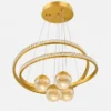 Lustre suspension doré à anneaux LED avec quatre boules lumineuses